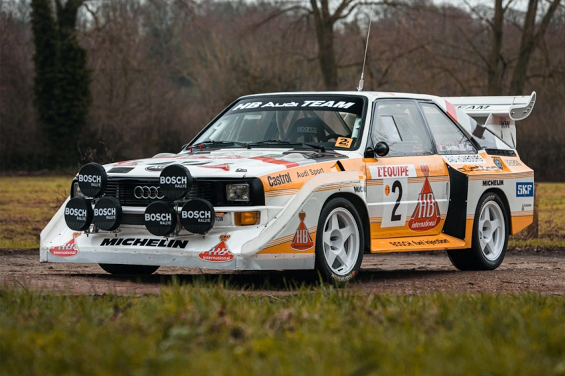 A side view of a 1986 Audi Sport Quattro S1 Evo 2 Rally Car in its natural habitat.