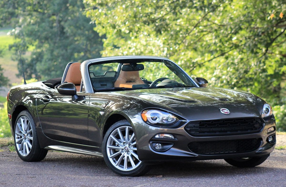 2017 Fiat 124 Spider on road with trees in background