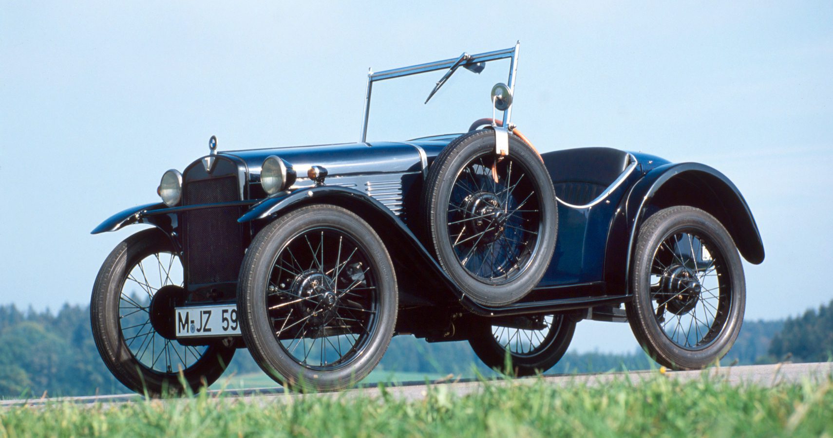 A 1928 BMW 3/15 PS in a field.