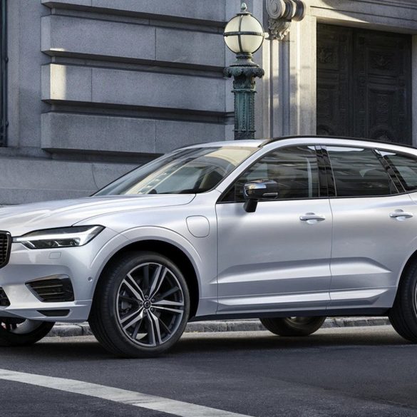 2022 Silver Volvo XC60 Recharge PHEV SUV on city street