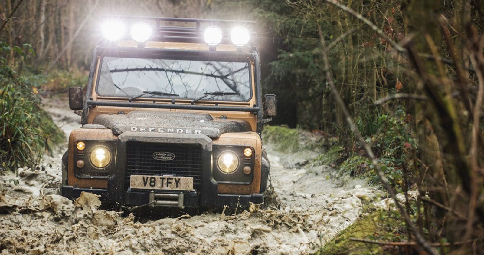 Yellow Defender Works V8 Trophy edition in mud
