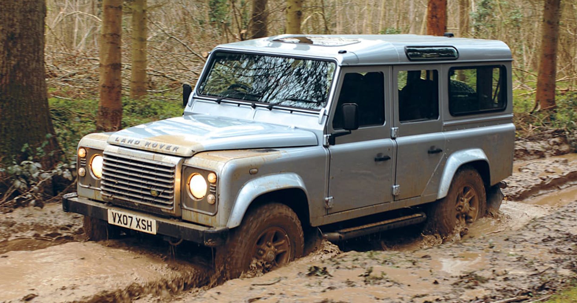 Land Rover Defender driving through mud
