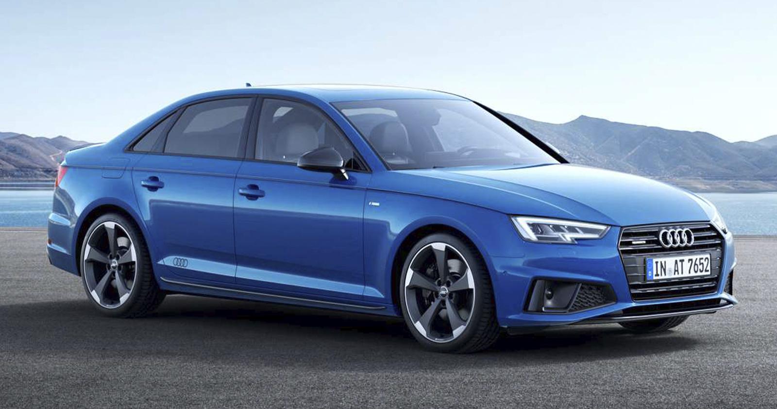 2022 blue Audi A4 with mountain and water background