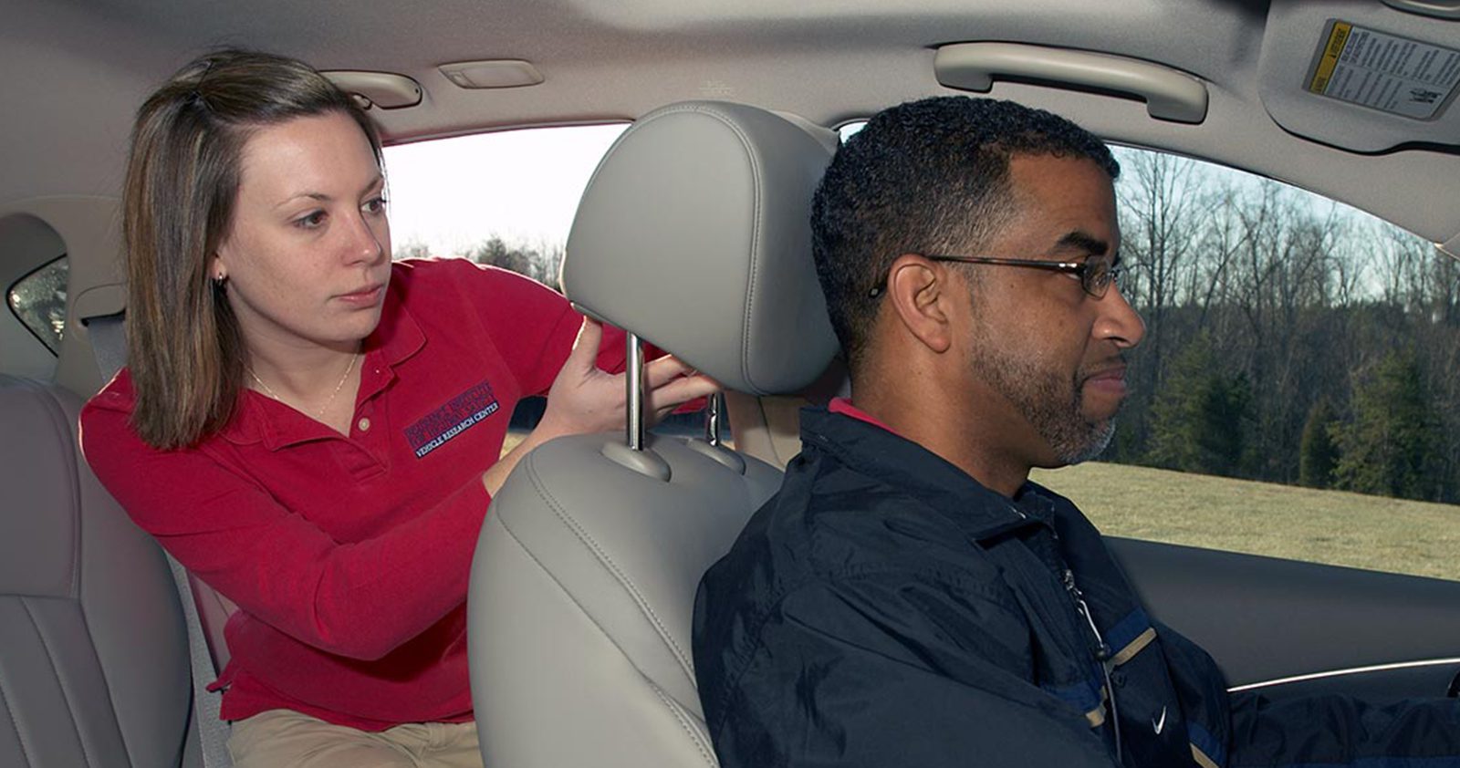 Adjusting seat headrest in a car