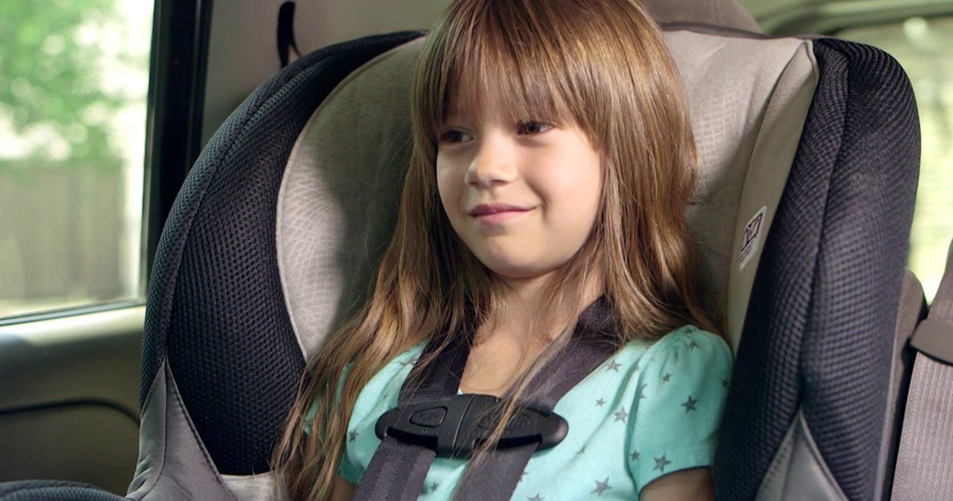 Young girl in car seat