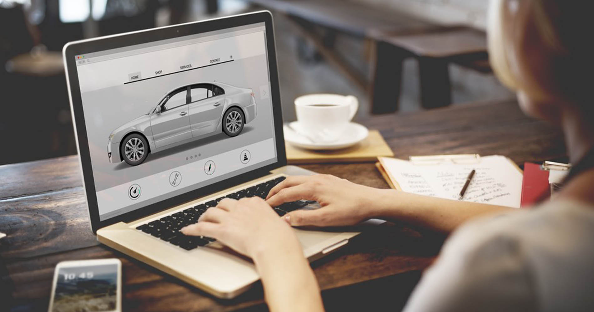 Girl looking at car on her laptop