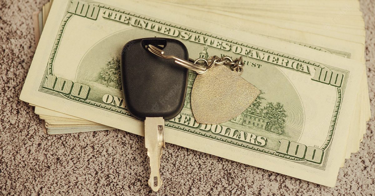 Car key and hundred dollar bills