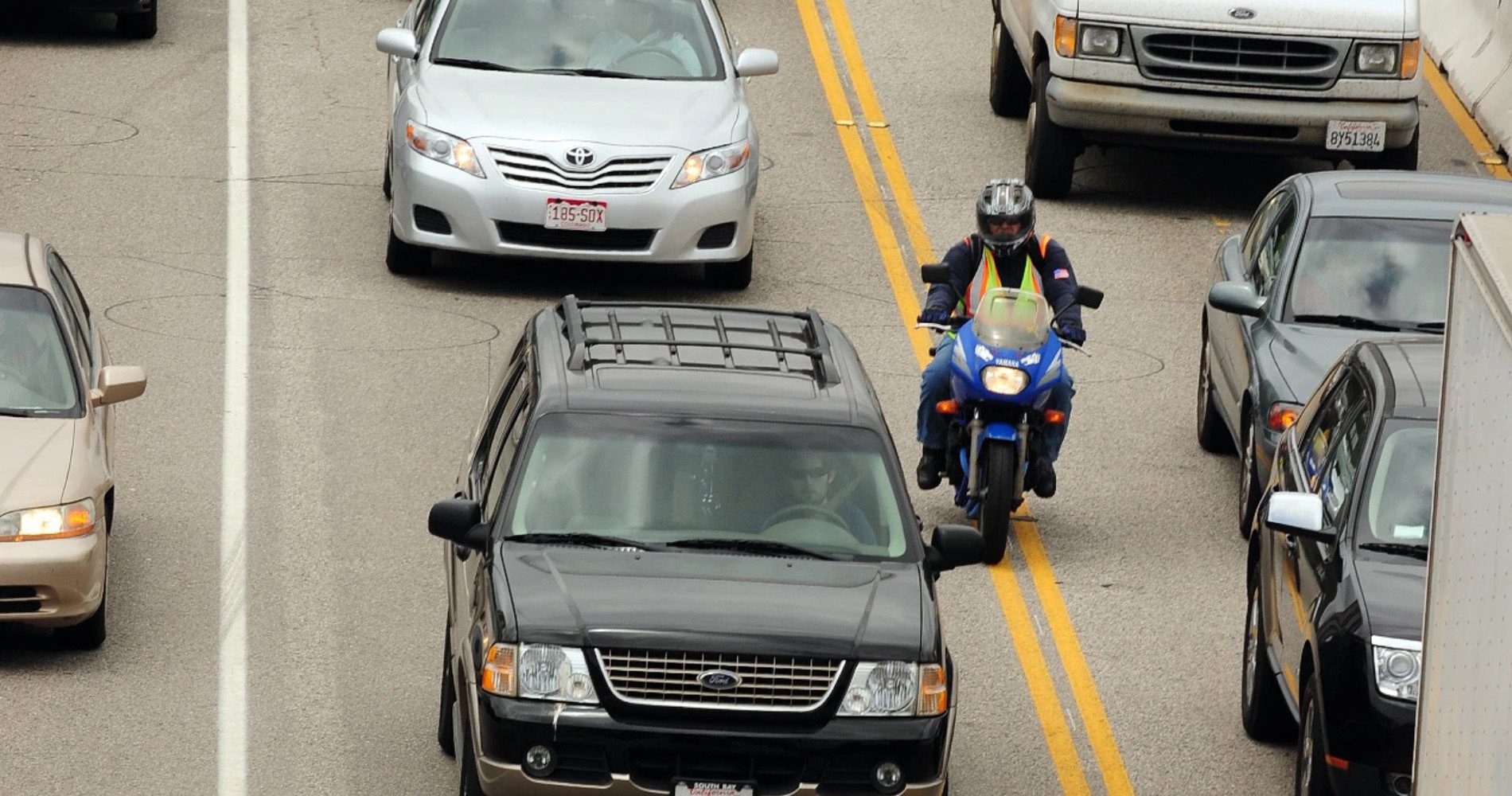 Motorcyclist filtering lanes in American road