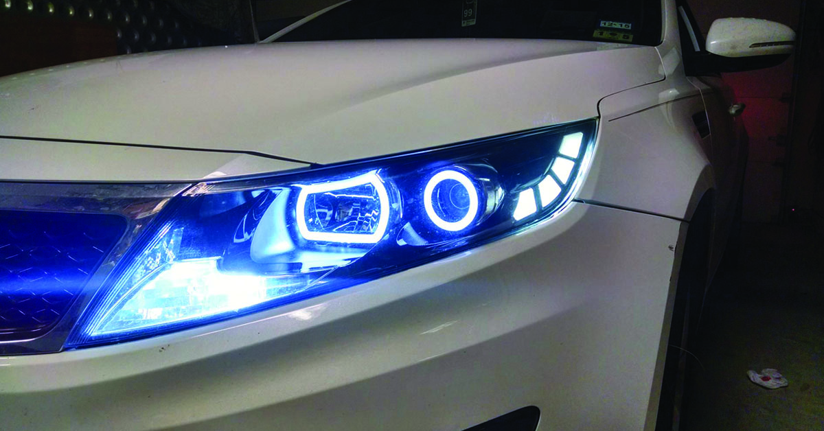 White Kia Optima with aftermarket LED headlights