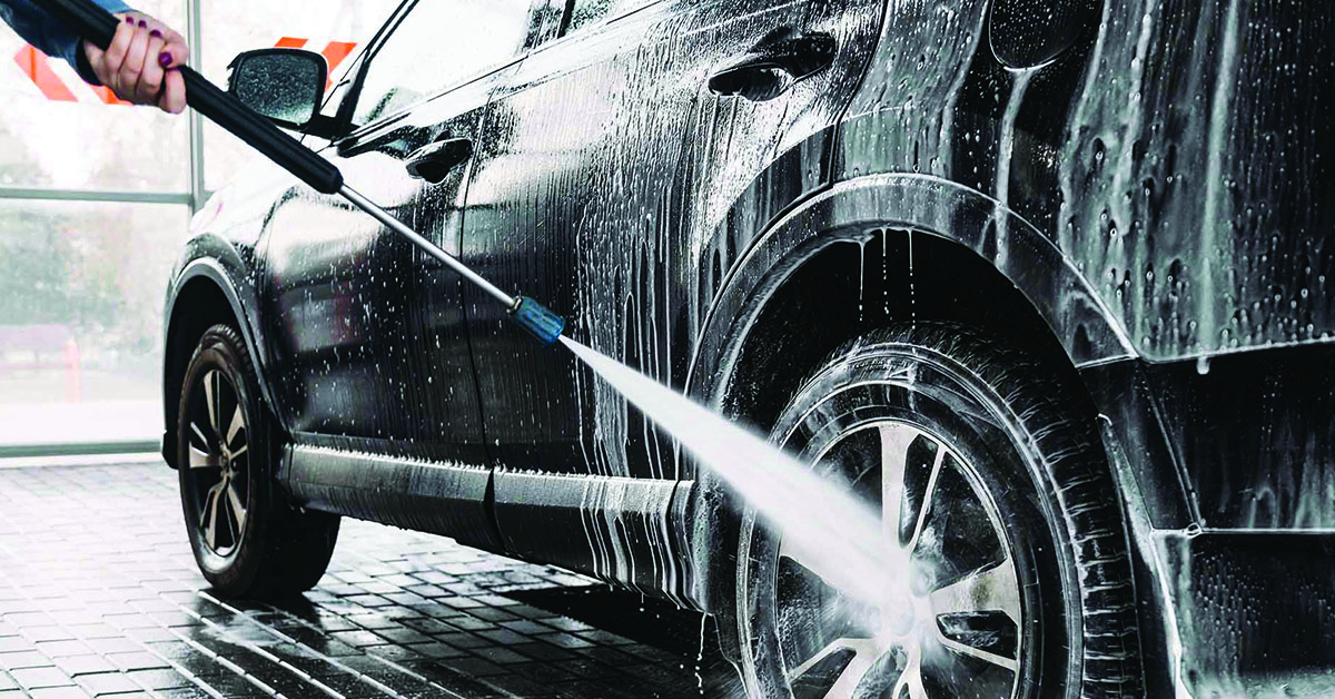 Washing a car with pressure hose
