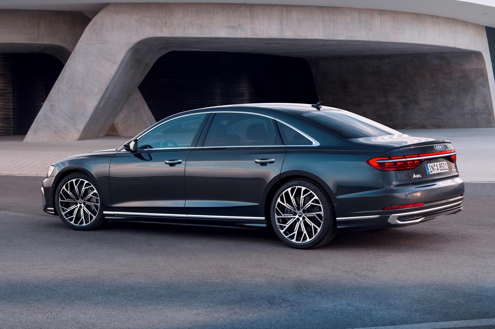 Rear angled view of a black 2023 Audi A8