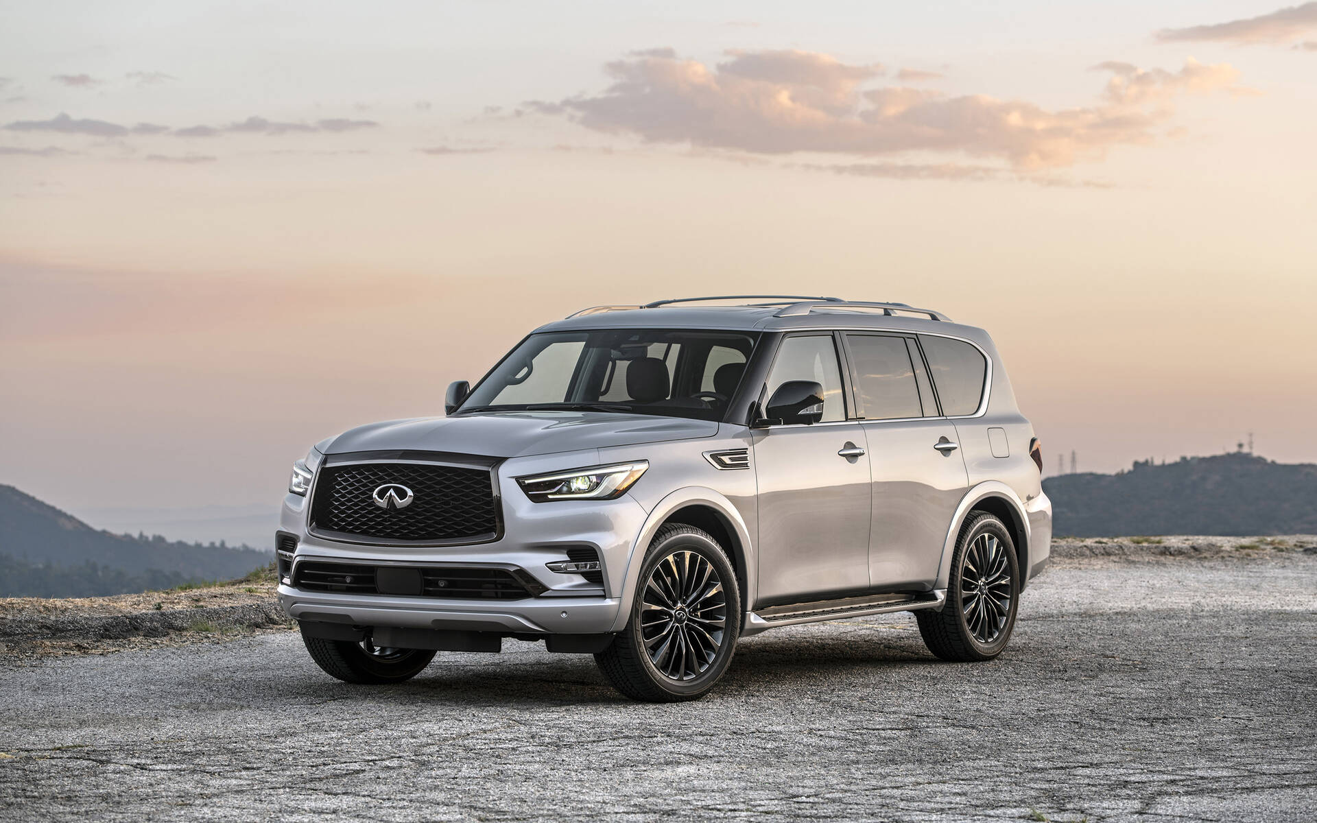 Front angled view of a silver Infiniti QX80