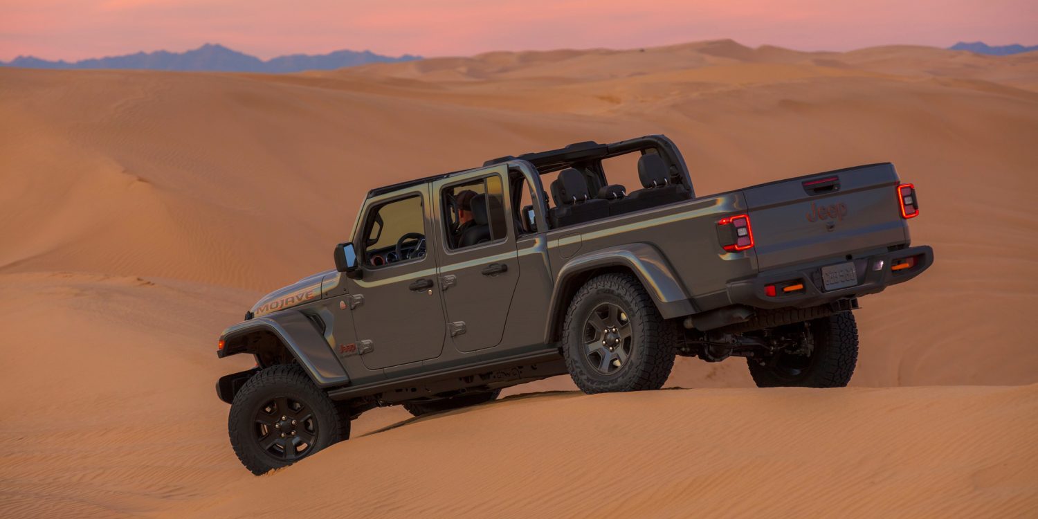 Side angle of a 2023 grey Jeep Gladiator Mojave