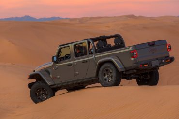 Side angle of a 2023 grey Jeep Gladiator Mojave
