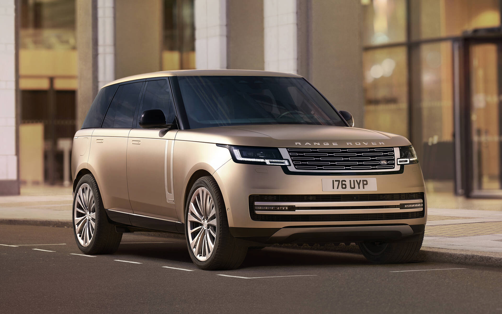 front angled view of a golden brown 2023 Land Rover Range Rover