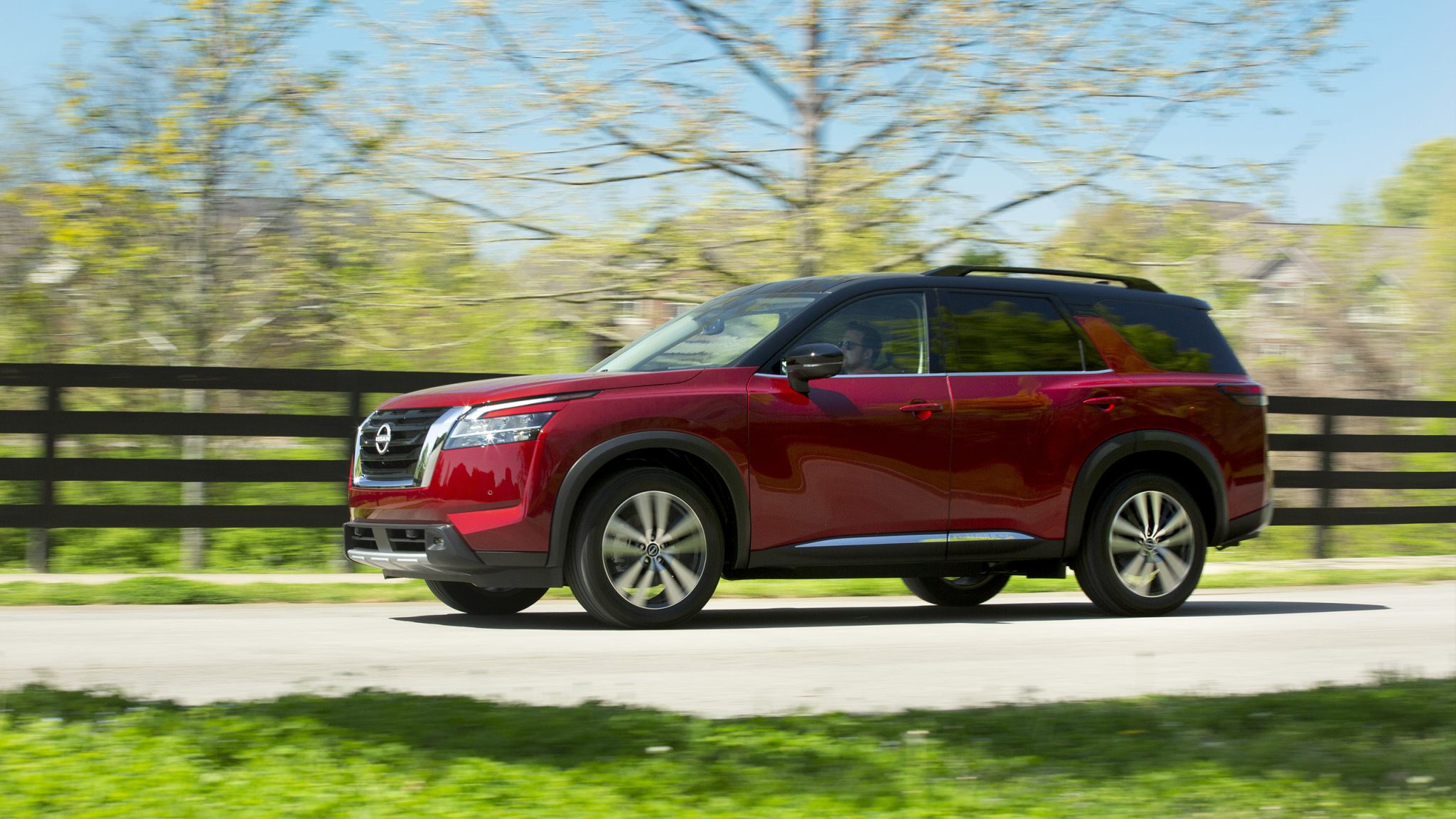 Side view of a 2023 red Nissan Pathfinder