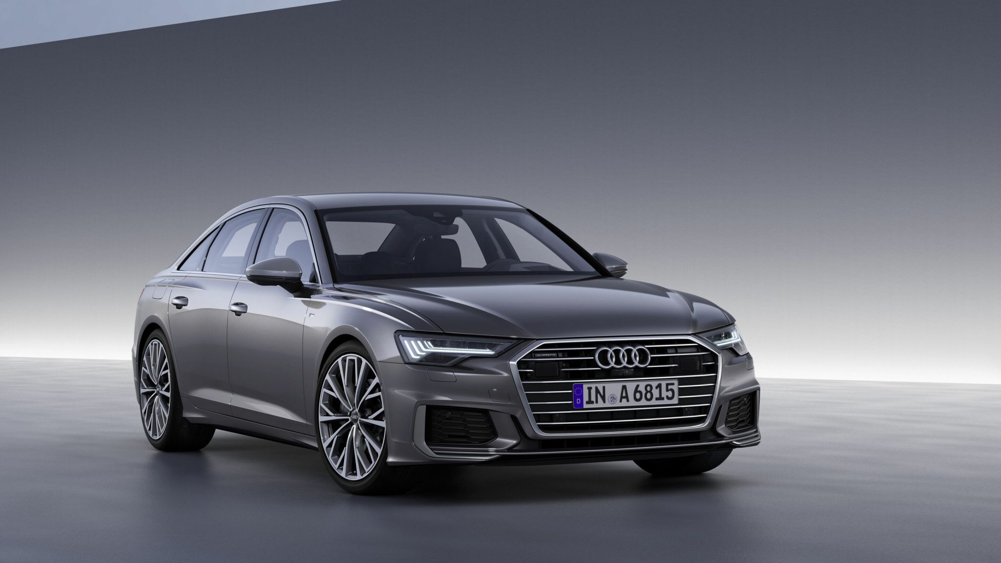 Three-quarter front view of a 2023 gray Audi A6