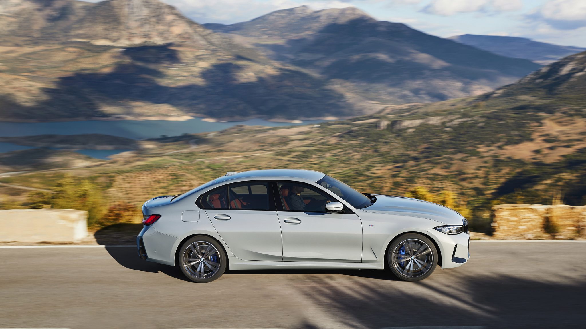 Side view of a 2023 grey BMW 330e