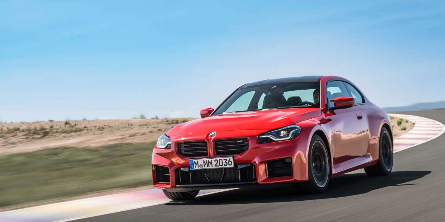 Three-quarter front view of a 2023 red BMW M2