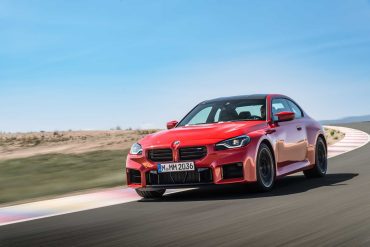 Three-quarter front view of a 2023 red BMW M2