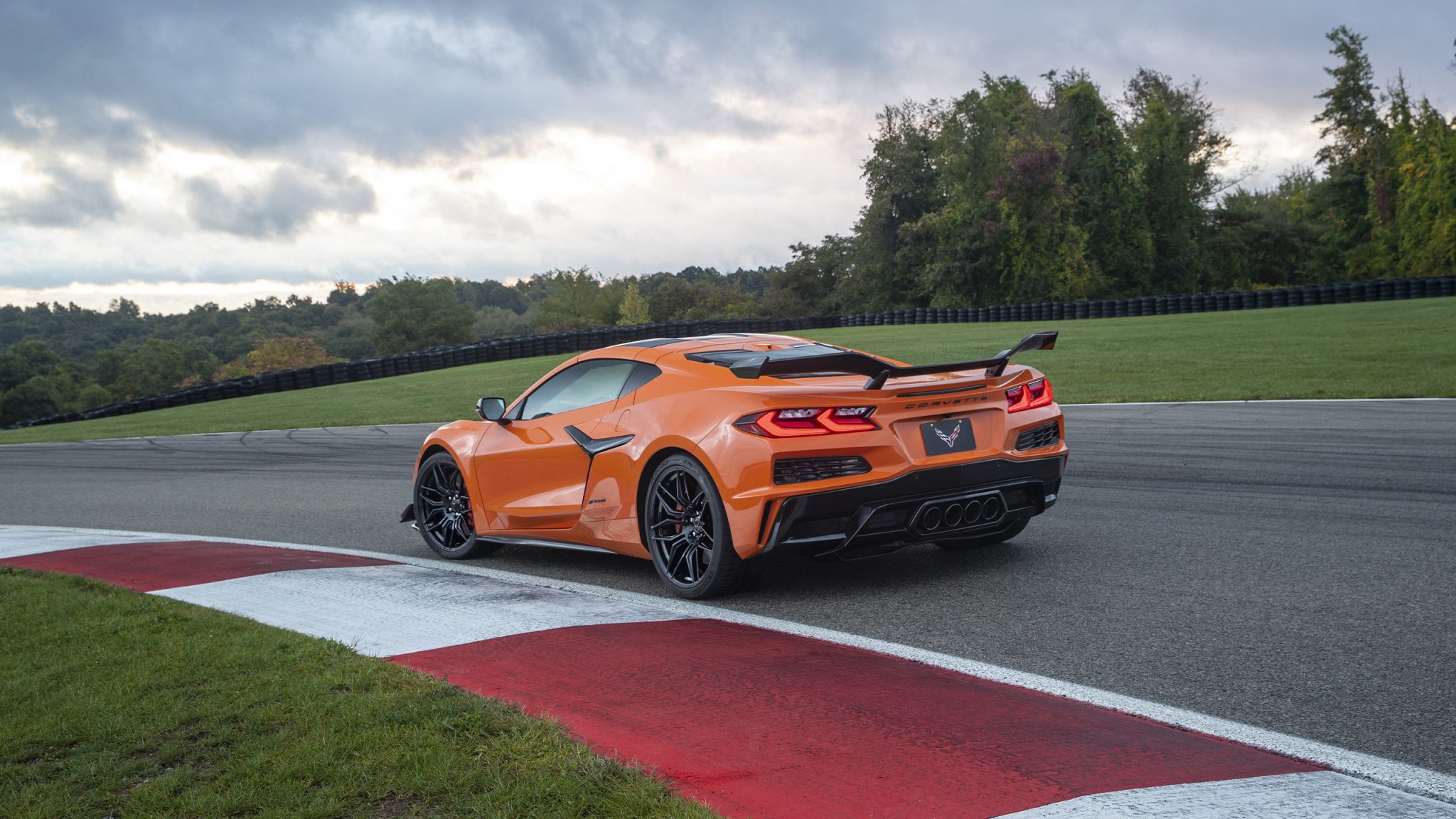 Three-quarter rear view of a 2023 orange Corvette Z06