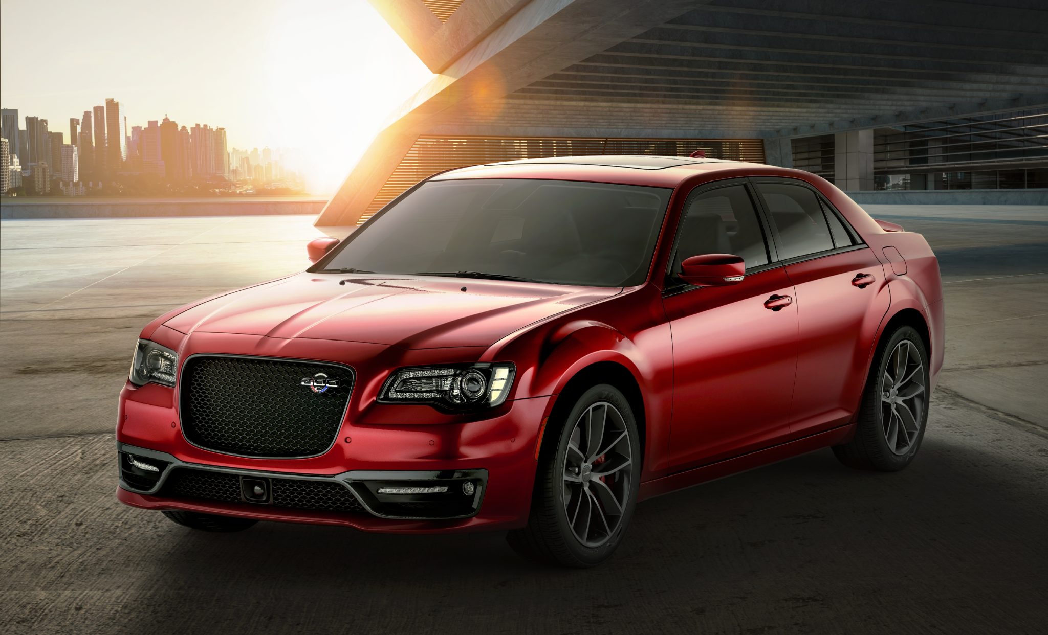 Three-quarter front view of a 2023 red Chrysler 300C