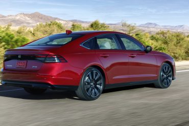 Three-quarter rear view of a 2023 red Honda Accord hybrid
