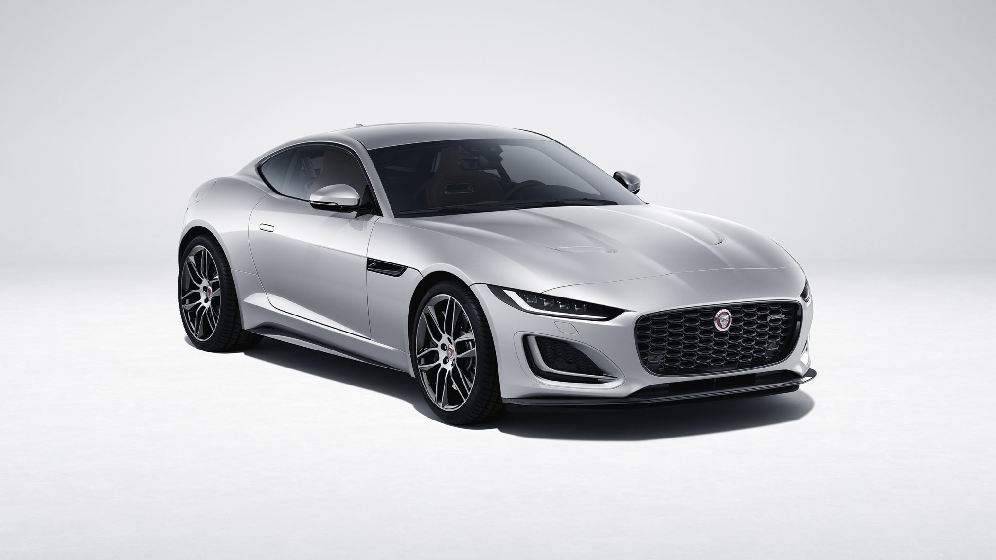 Three-quarter front view of a 2023 silver Jaguar F-type R-Dynamic