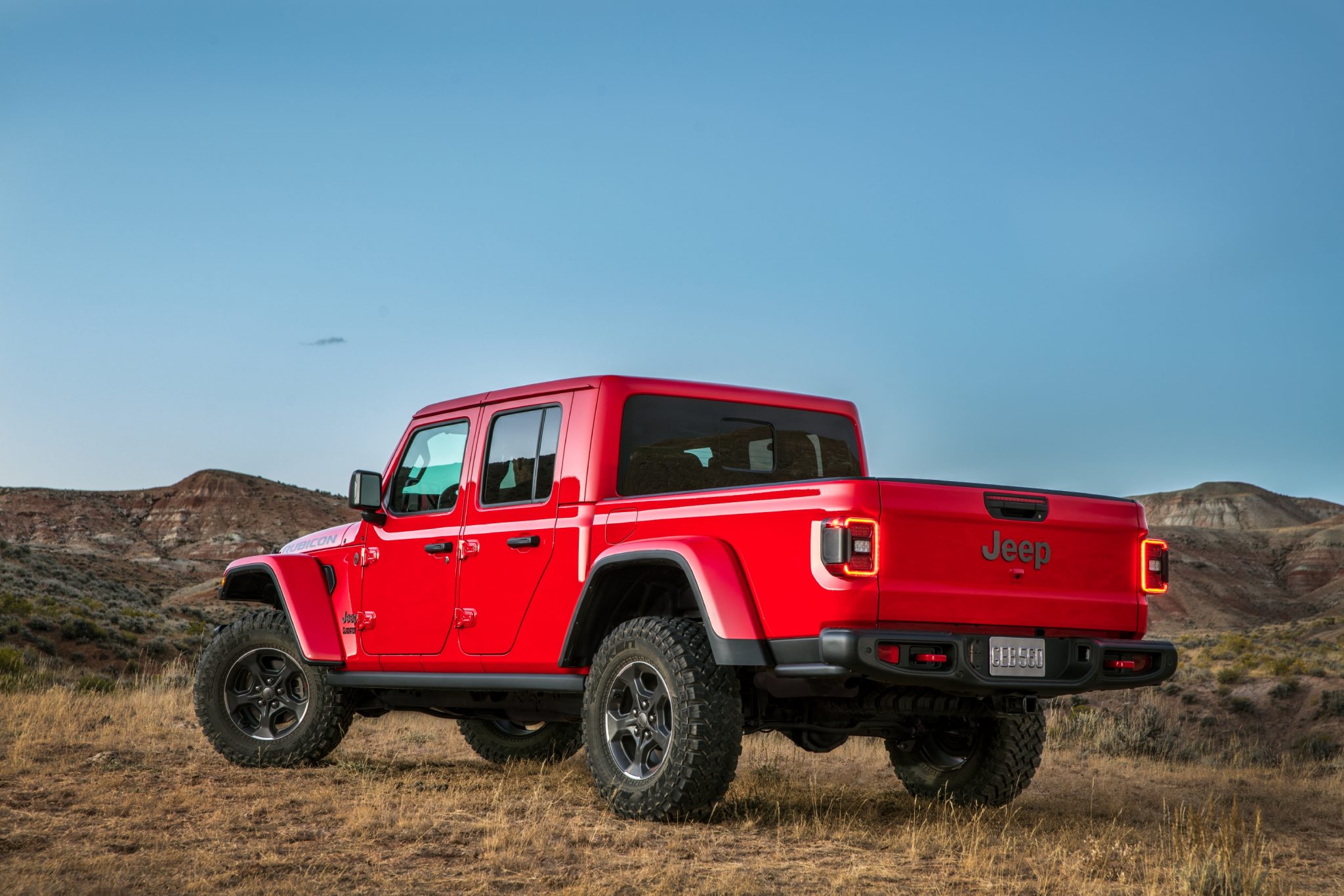 Three-quarter rear view of a 2023 red Jeep Gladiator