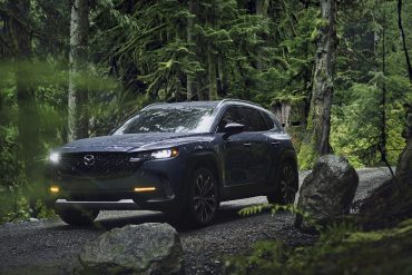 Three-quarter front view of a 2023 gray Mazda CX-50