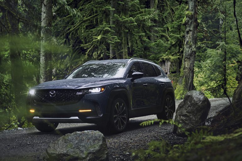 Three-quarter front view of a 2023 gray Mazda CX-50