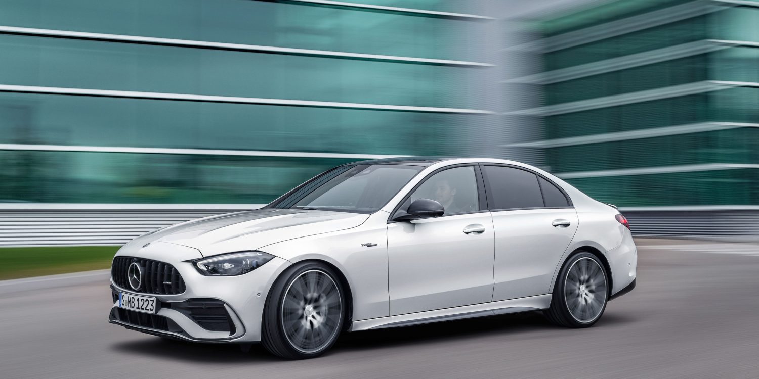Three-quarter side view of a 2023 white Meredes AMG C43 4Matic