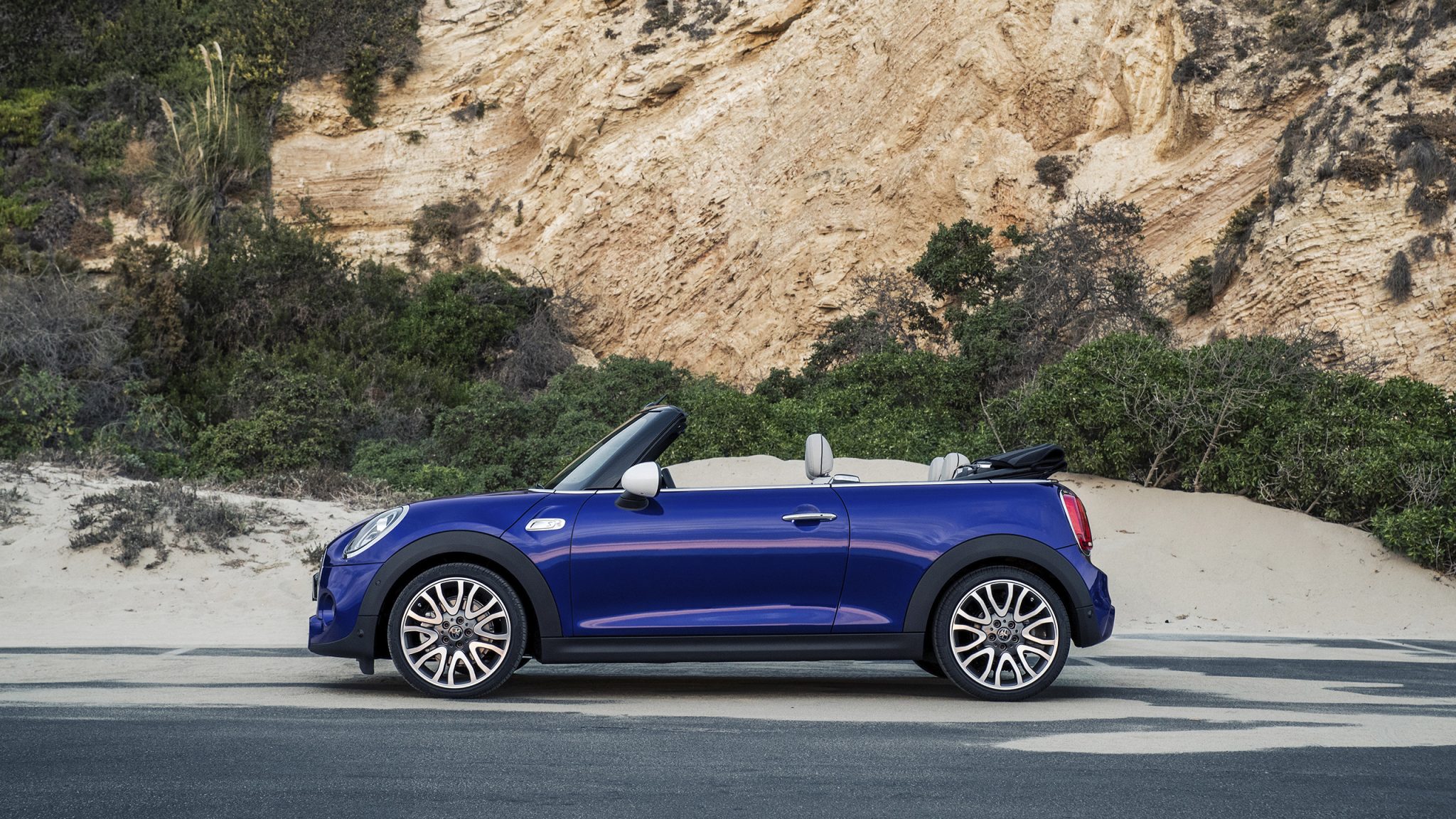 Side view of a 2023 blue MINI Convertible