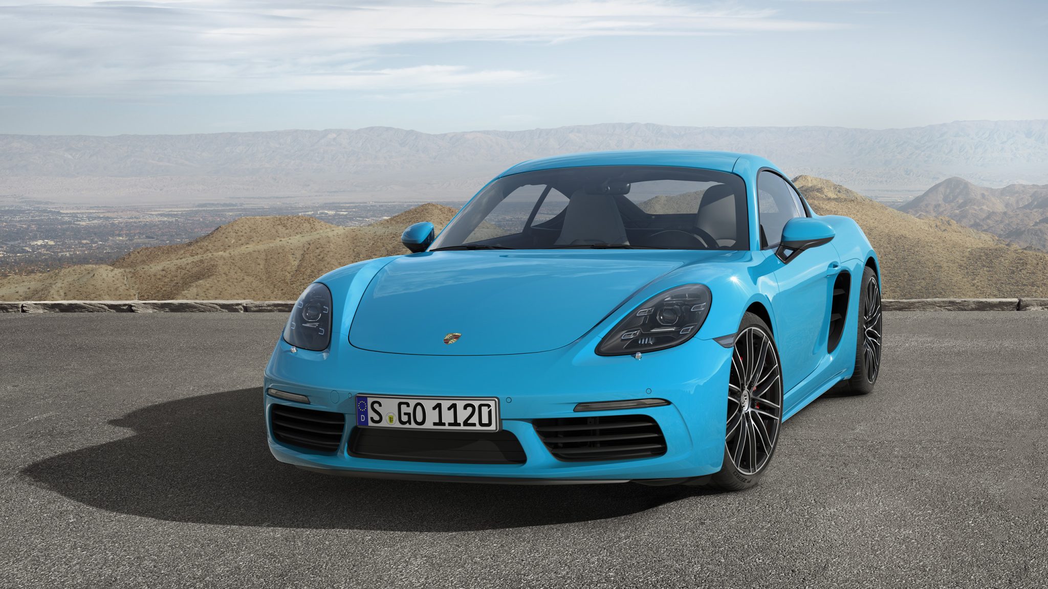 Front view of a 2023 blue Porsche Cayman S