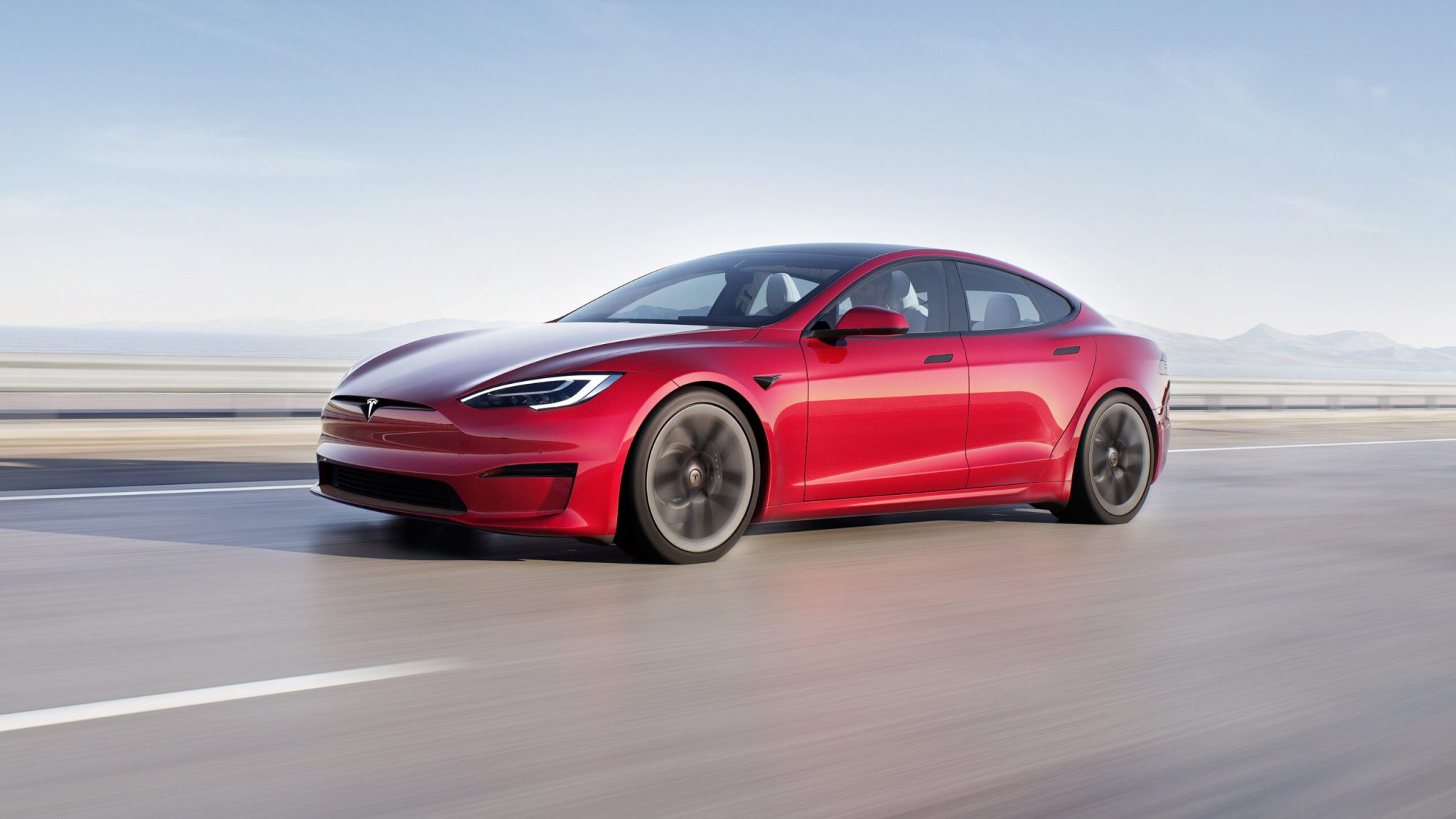 Three-quarter front angle of a 2023 red Tesla Model S Plaid