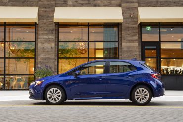 Side view of a 2023 blue Toyota Corolla hatchback