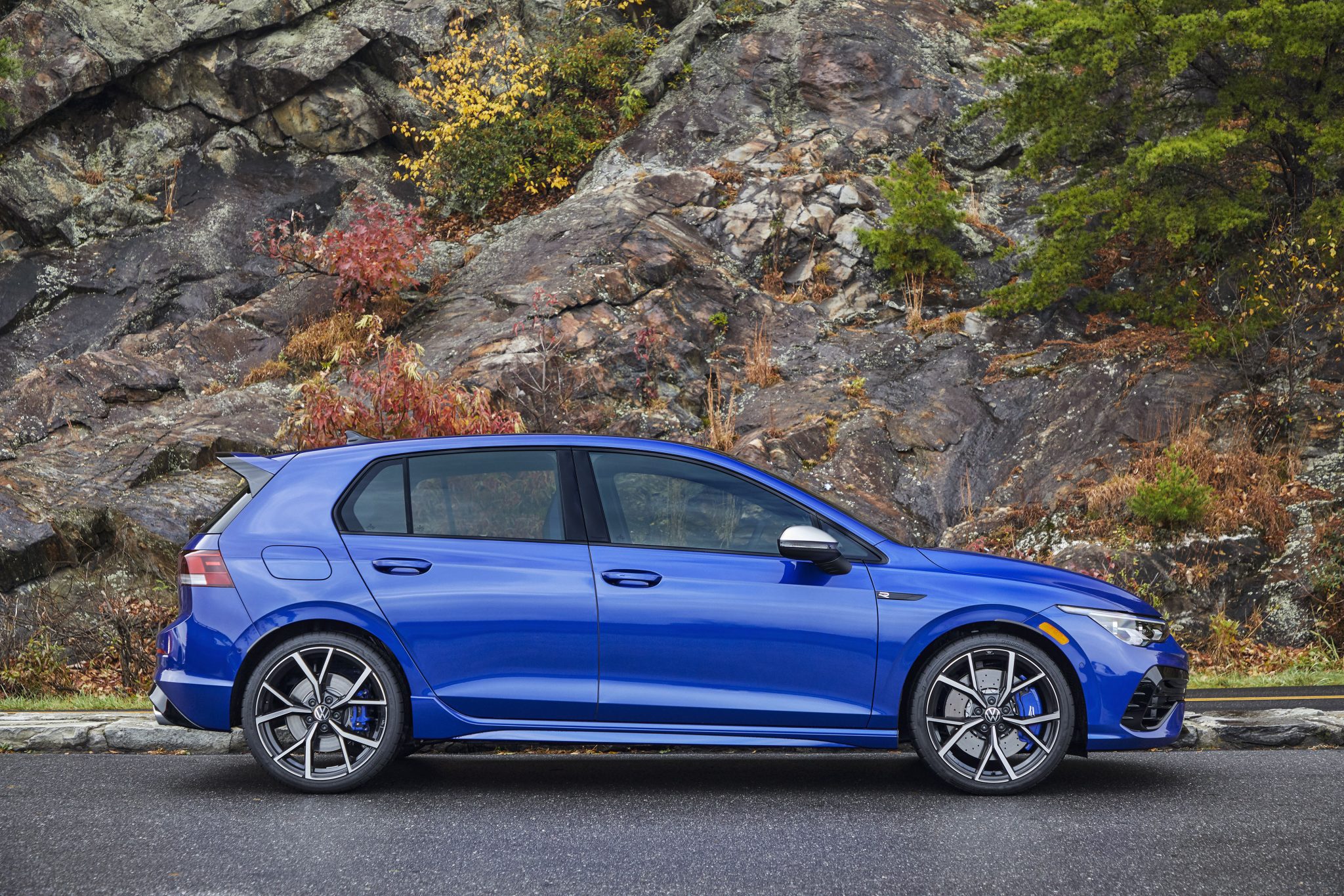 Side view of a 2023 blue Volkswagen Golf R
