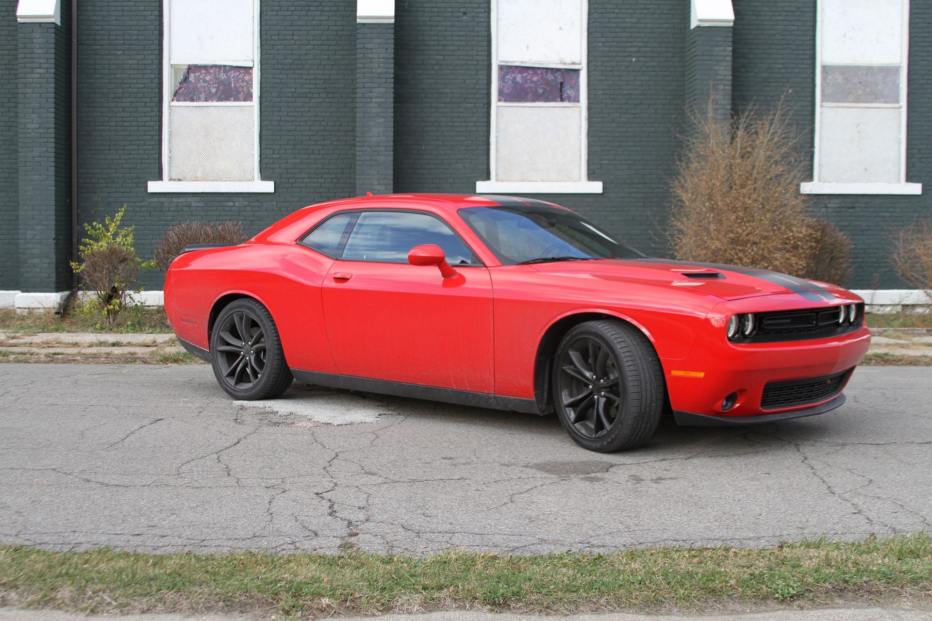 Front angled view of a red Dodge Challenger SXT