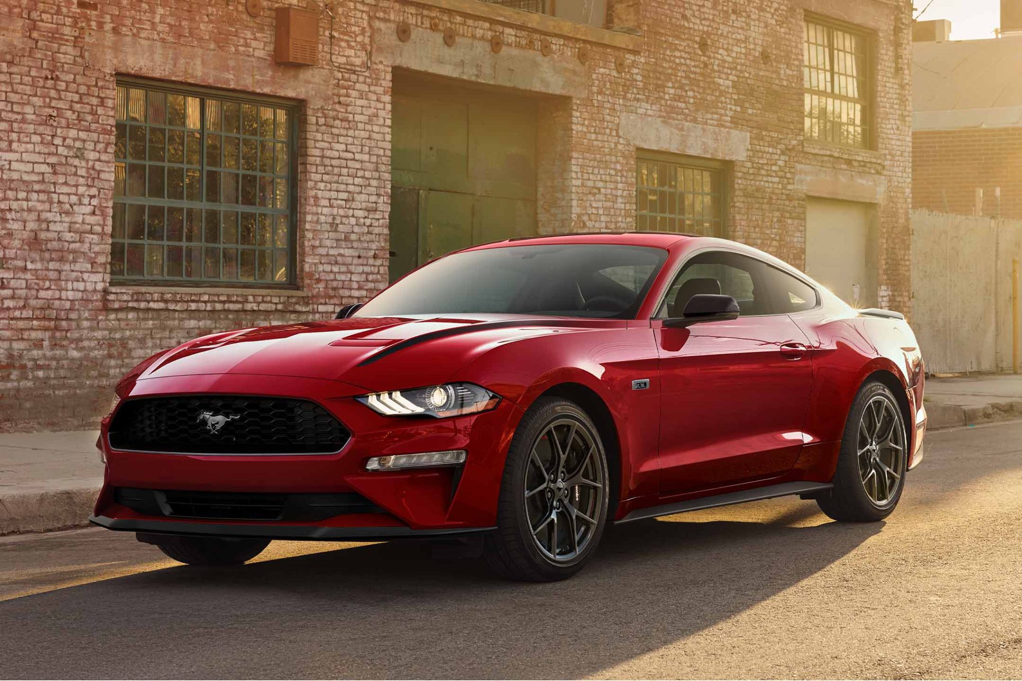 Front angled view of a red 2023 Ford Mustang EcoBoost