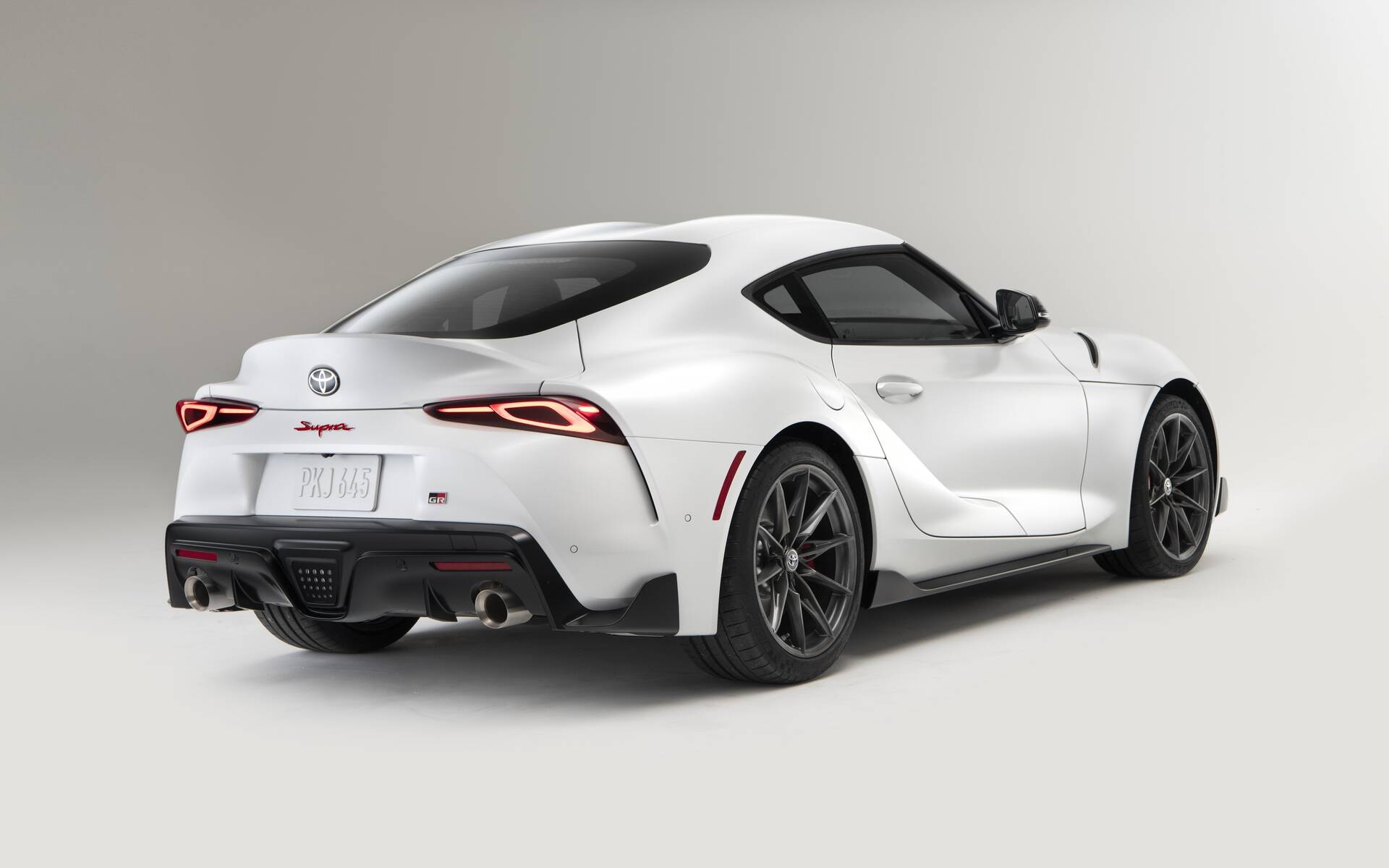 rear angled view of a white 2023 Toyota GR Supra