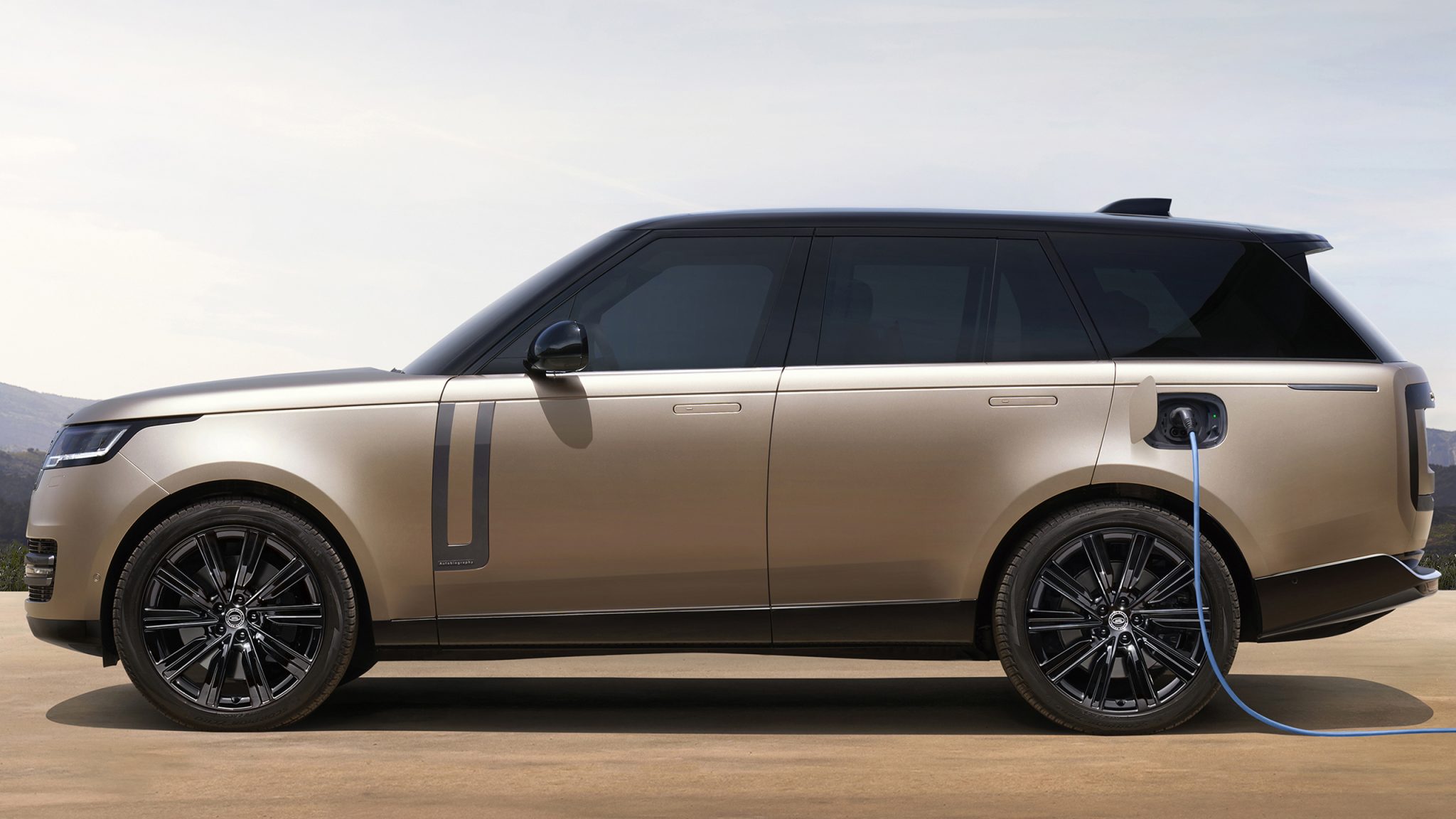 Side view of a 2023 Land gold Rover Range Rover PHEV