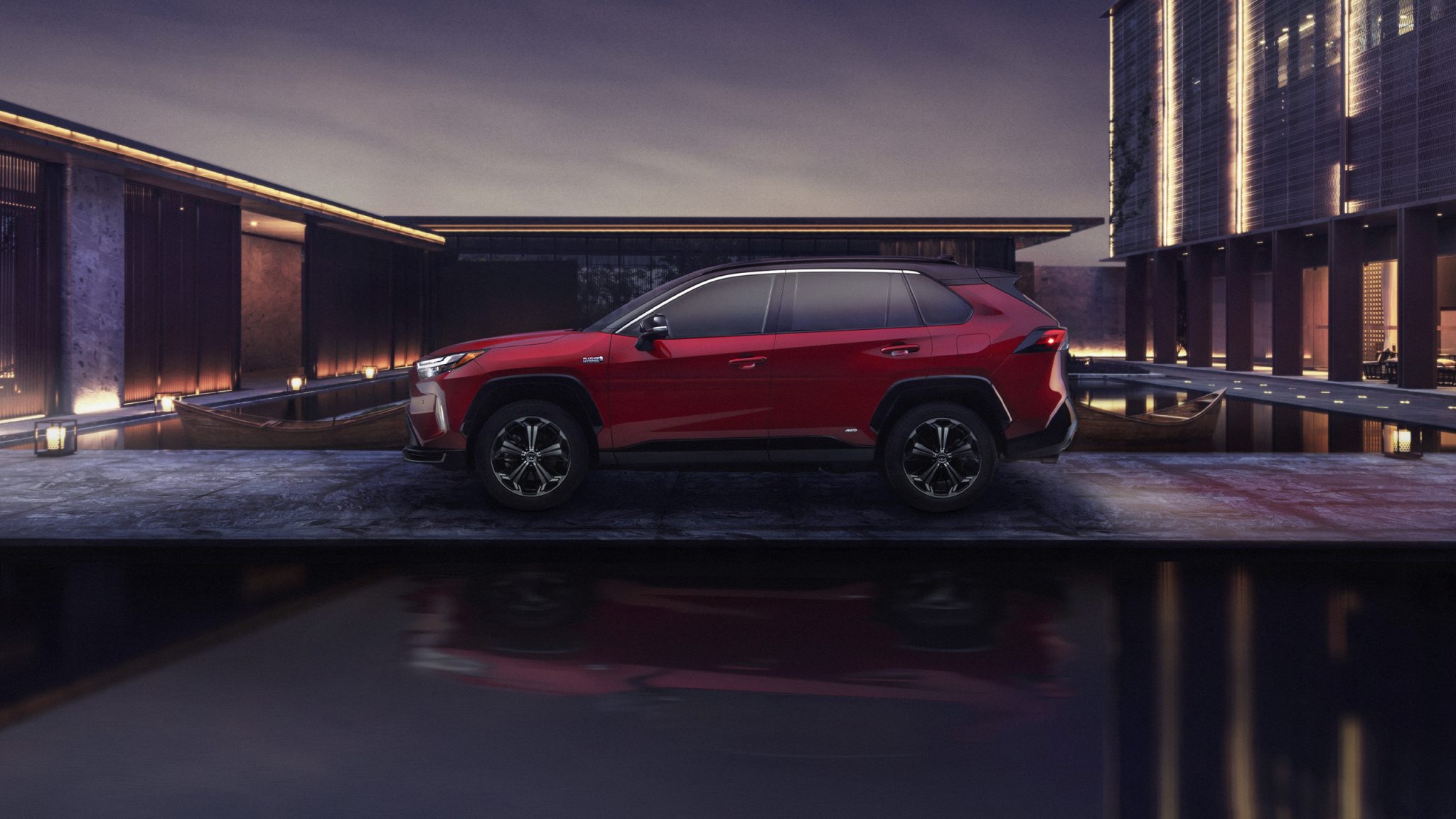 Side view of a 2023 red Toyota RAV4 Prime