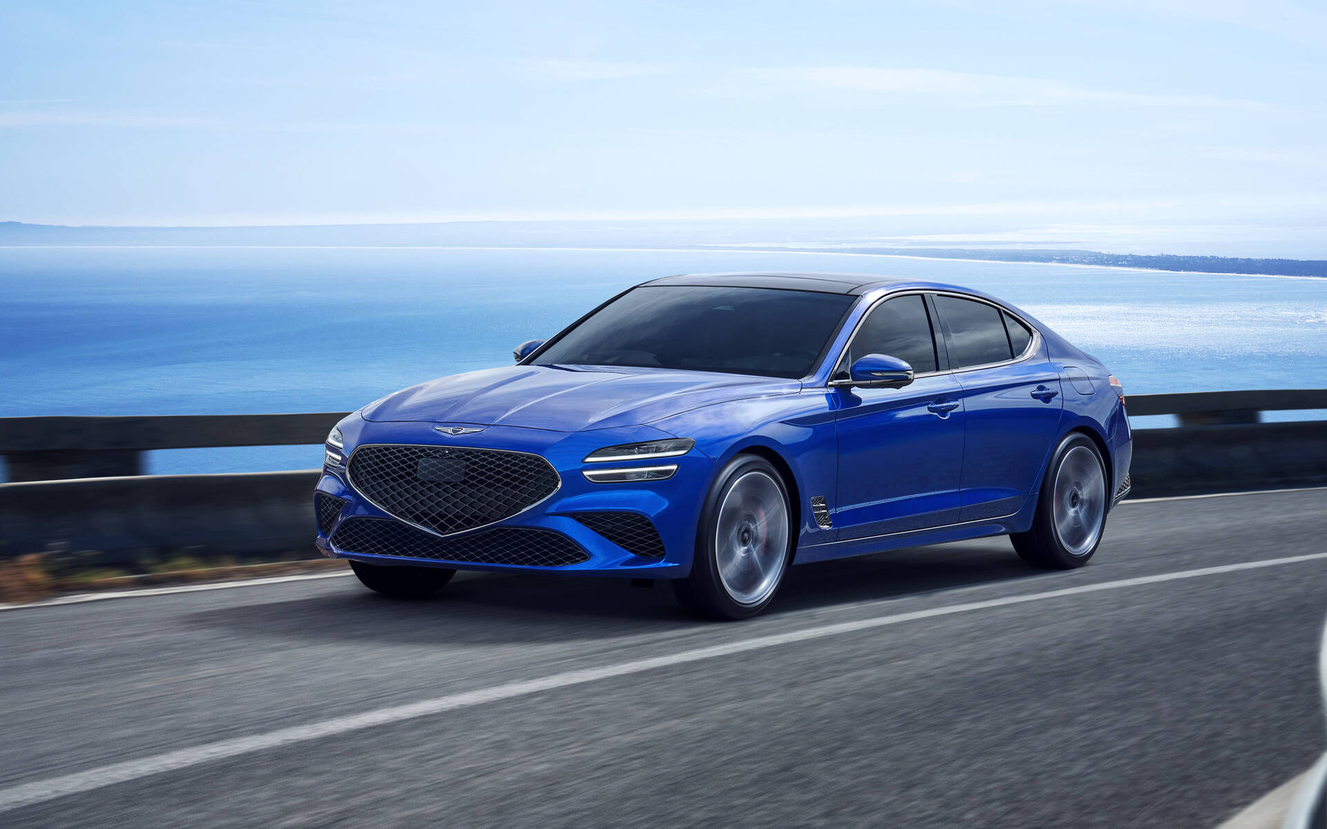 Front-angled view of a blue Genesis G70 sedan