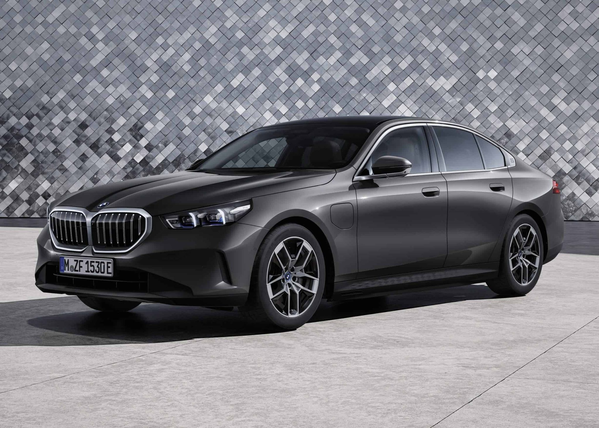 front angled image of a dark grey 2024 BMW 5 Series