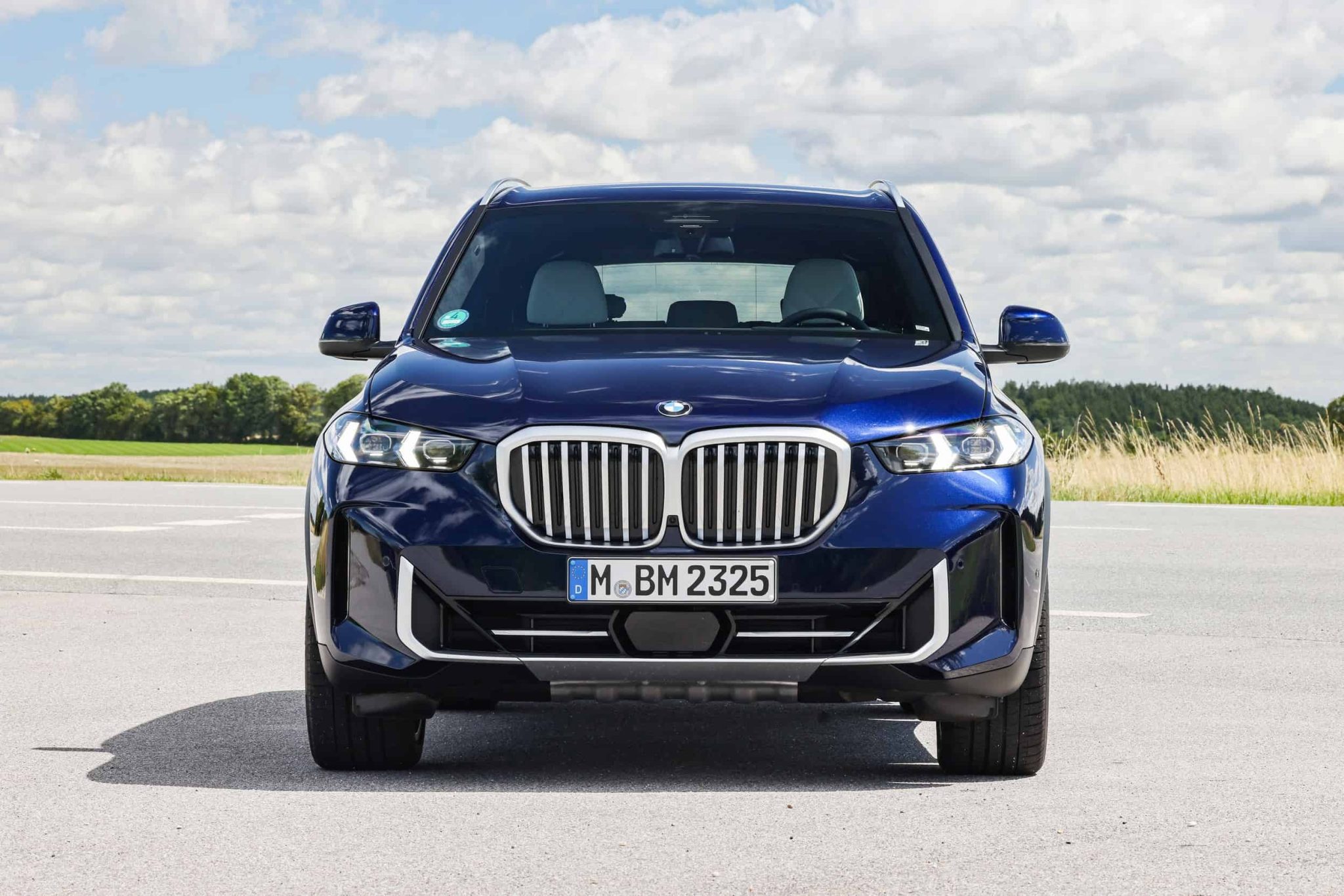 frontal view of a blue 2024 BMW X5