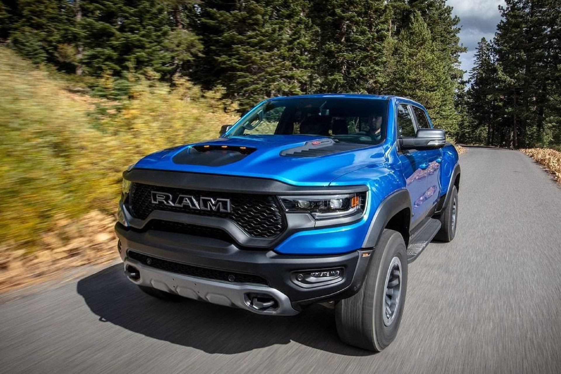 Front-angled view of a blue RAM 1500 TRX