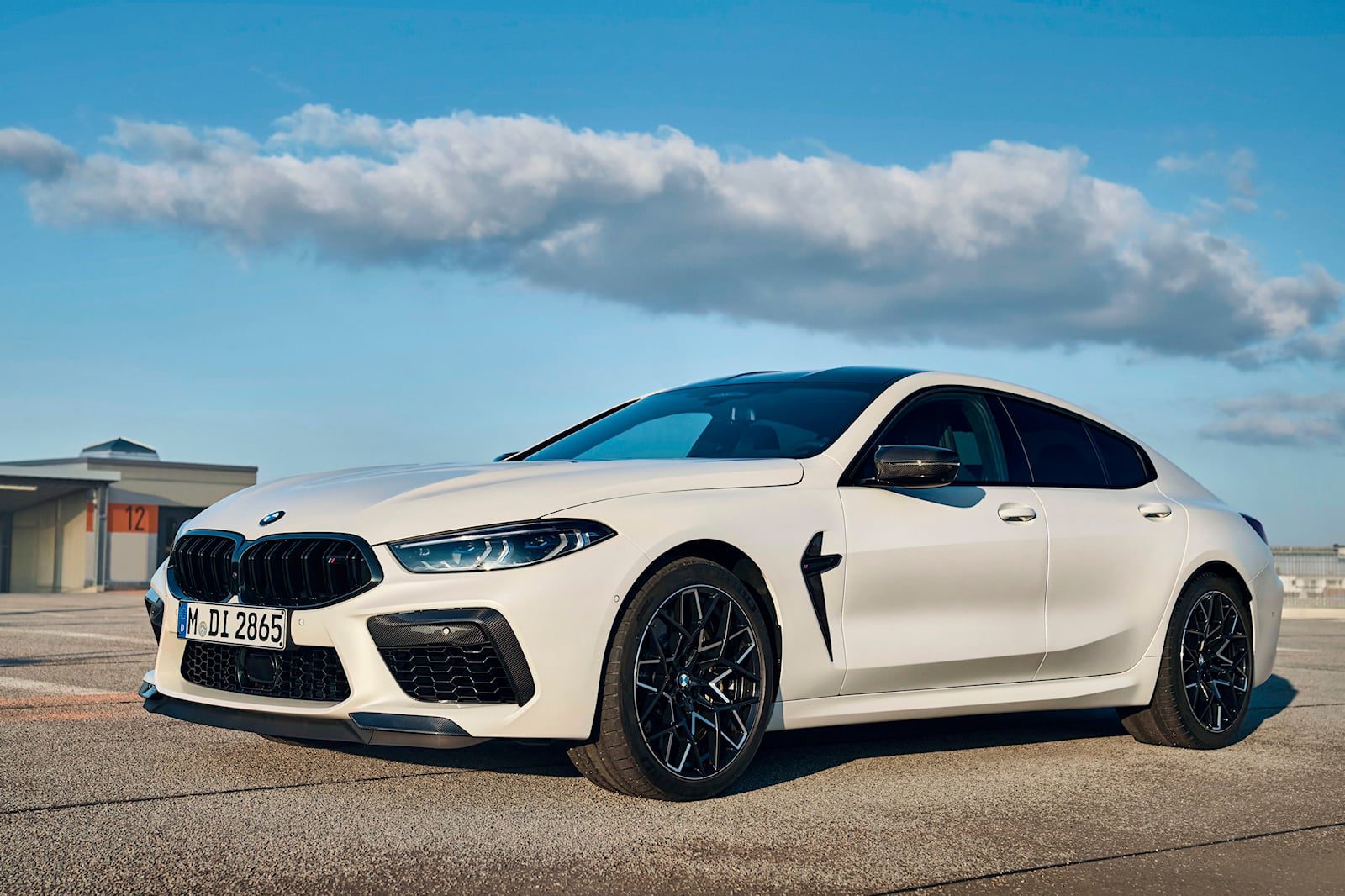 front angled view of a white BMW M8 Competition