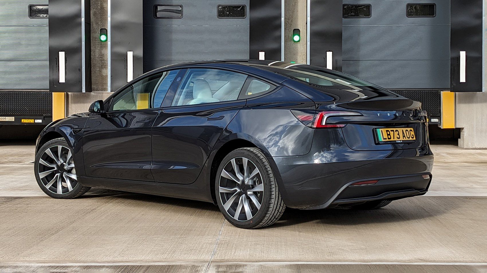 Rear-angled view of the 2024 Tesla Model 3