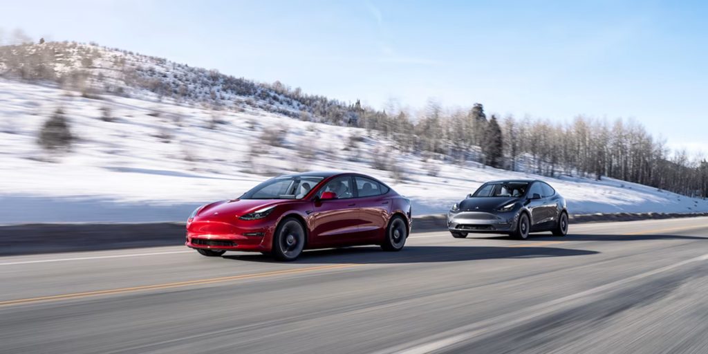 Tesla EV cars driving in winter