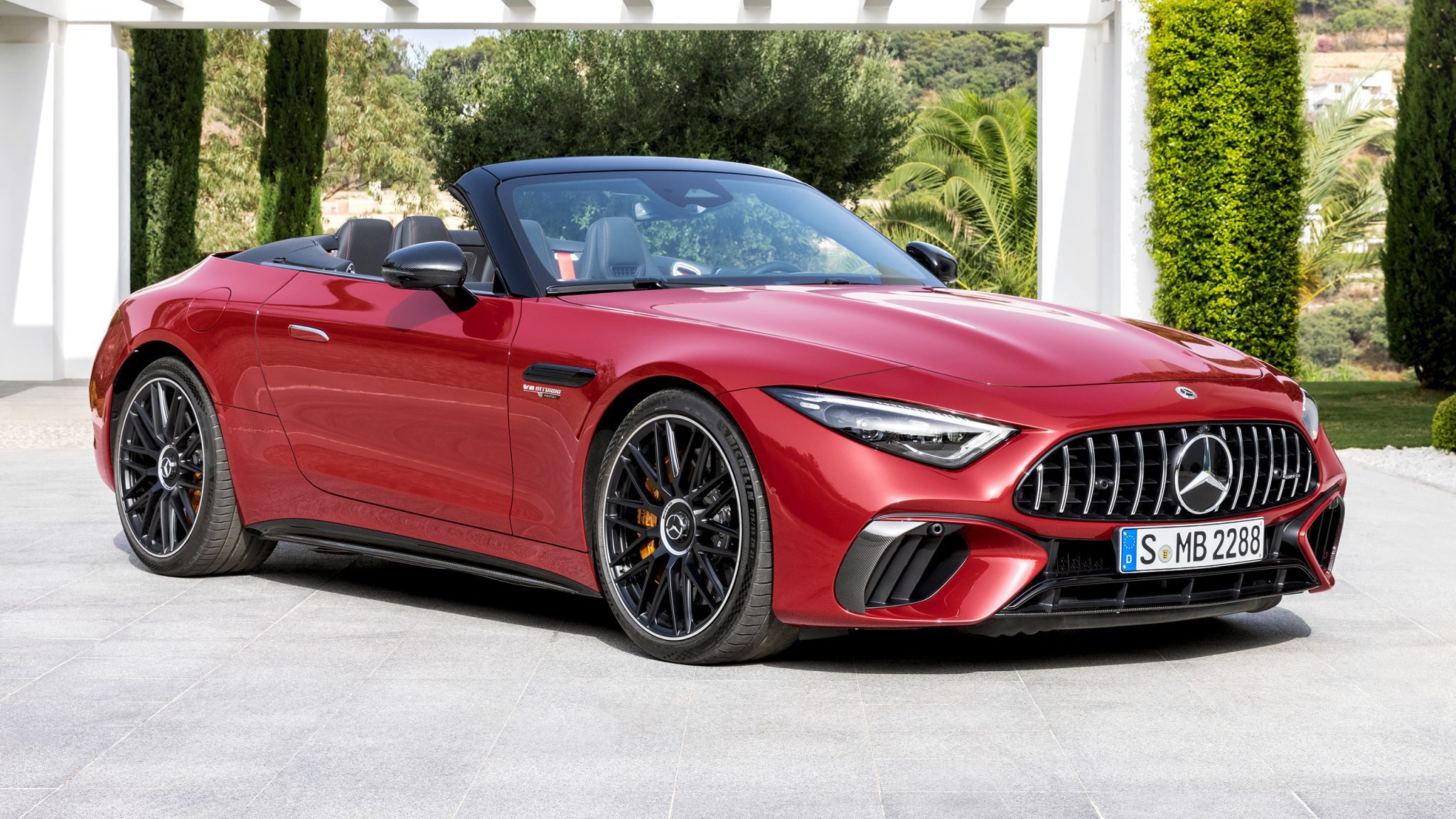 Front-angled view of a red Mercedes-AMG SL 63 roadster.
